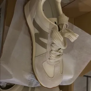 N Cream and Tan Retro Sneakers. New Balance look a like