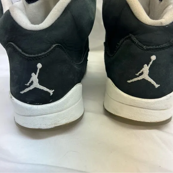 Nike Air Jordan 5 Retro Oreo tennis shoes.